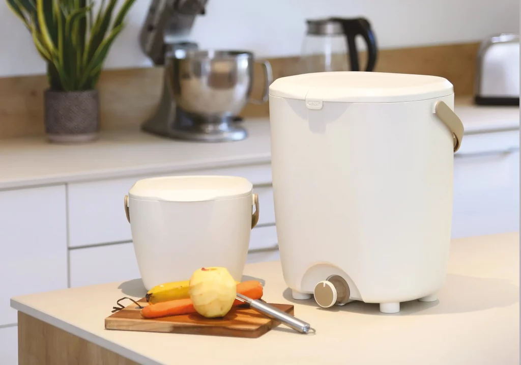 Bokashi bins above a kitchen counter used for indoor composting of kitchen scraps